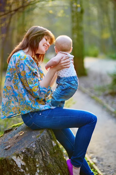 Young mother with her little son on a spring day — Stock Photo, Image