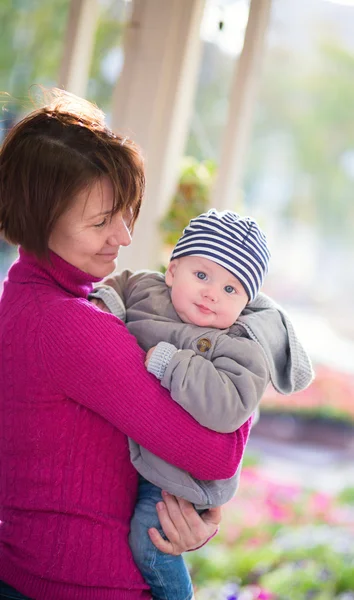 Middle aged woman and her little grandson — Stock Photo, Image