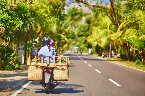Balinese man on scooter — Stock Photo, Image