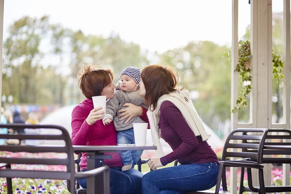 Grandmother, mother and grandson in a cafe — Stock Photo, Image
