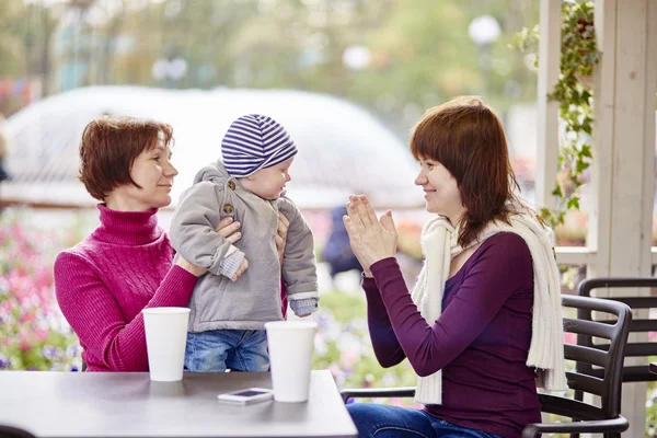 Grandmother, mother and grandson in a cafe — Stock Photo, Image