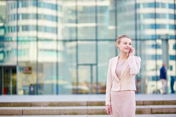 Young confident business woman using phone — Stock Photo, Image