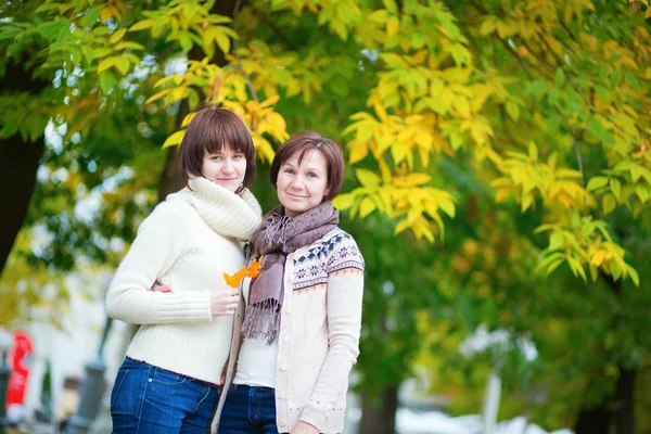 Middle aged woman with daughter on a fall day — Stock Photo, Image