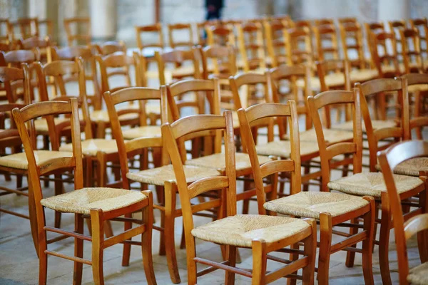 Many wooden chairs in church — Stock Photo, Image