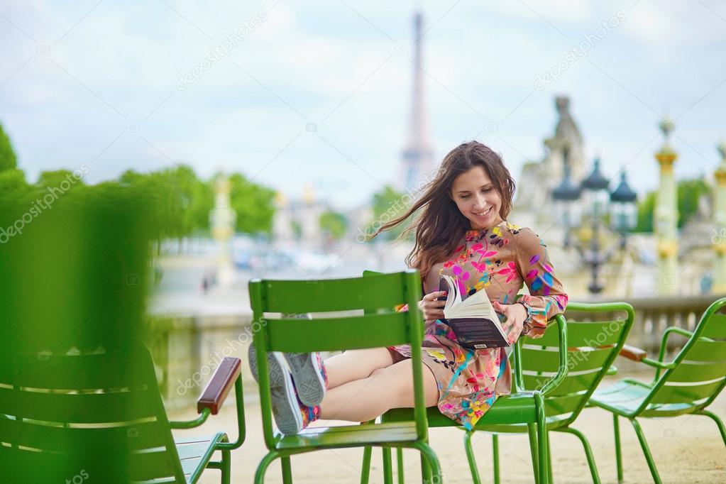 Young Parisian woman reading a book