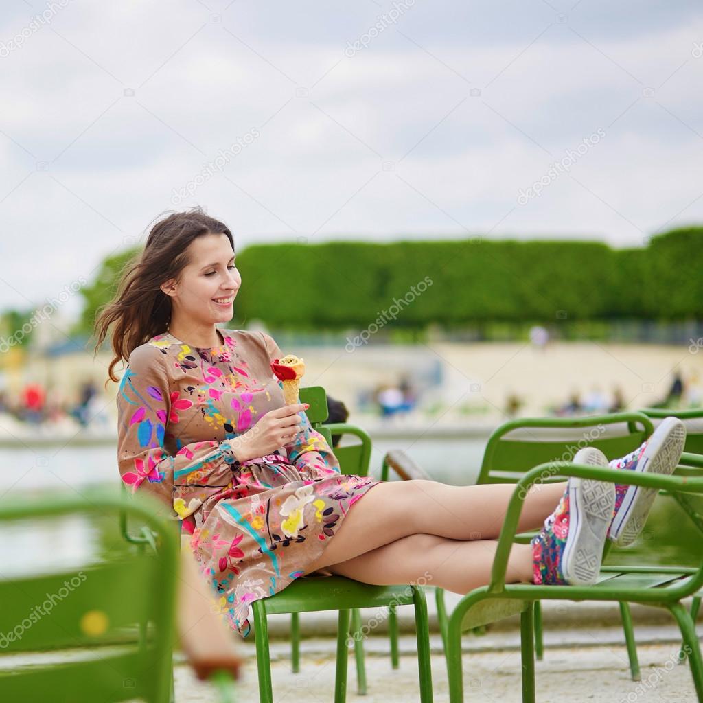 Young Parisian woman eating ice cream