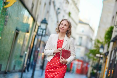Beautiful young woman walking in Paris
