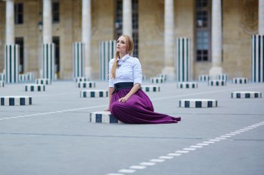 Beautiful young woman in Palais Royal