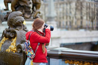 Tourist in Paris on the Pont Alexandre III clipart