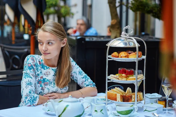 Young woman at high tea ceremony — Stock Photo, Image