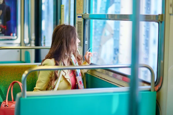 Beautiful young woman travelling in a train — Stock Photo, Image