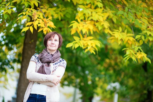 Beautiful middle aged woman outdoors — Stock Photo, Image