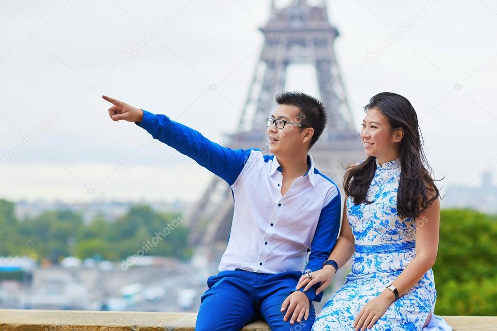 Young romantic Asian couple in Paris