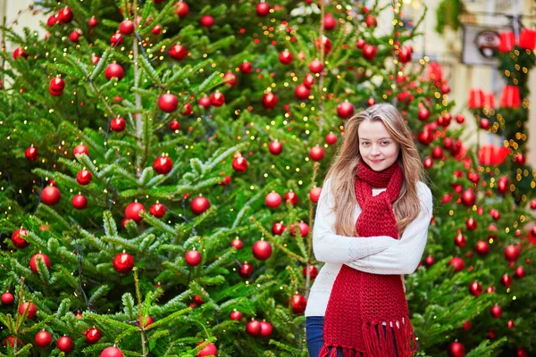 Cheerful girl with brightly decorated Christmas tree — Stock Photo, Image