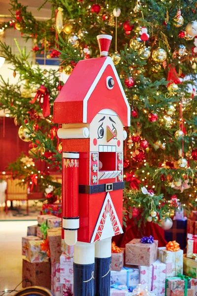 Nutcracker and decorated Christmas tree — Stock Photo, Image