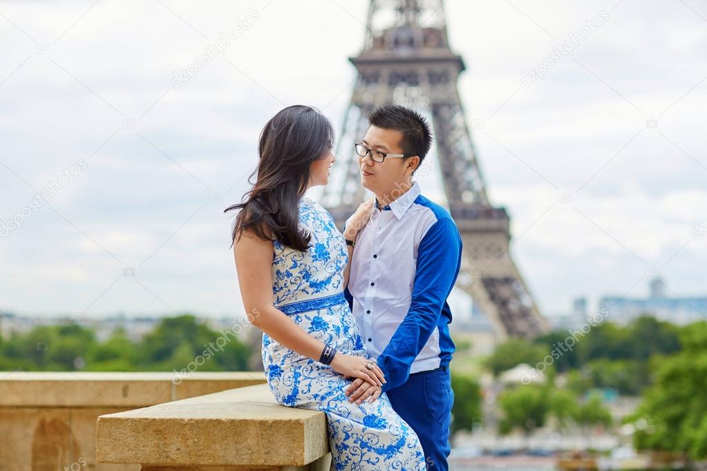 Young romantic Asian couple in Paris, France