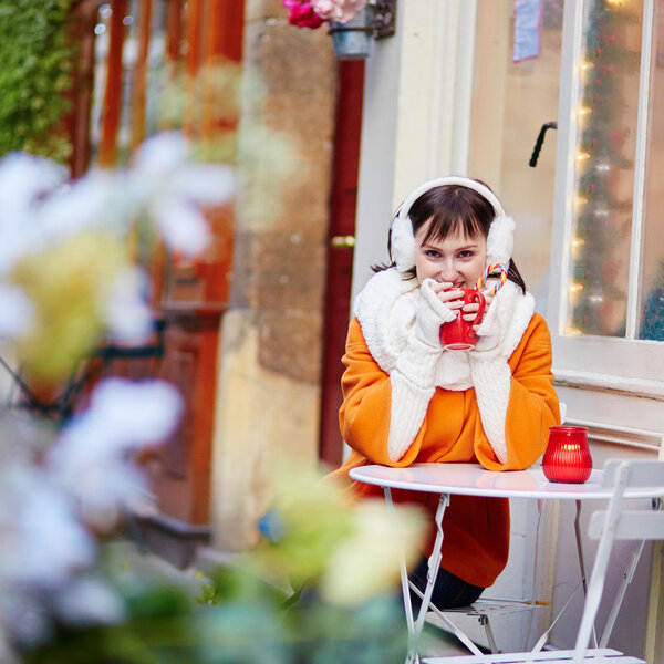 Happy young tourist in Paris on a winter day