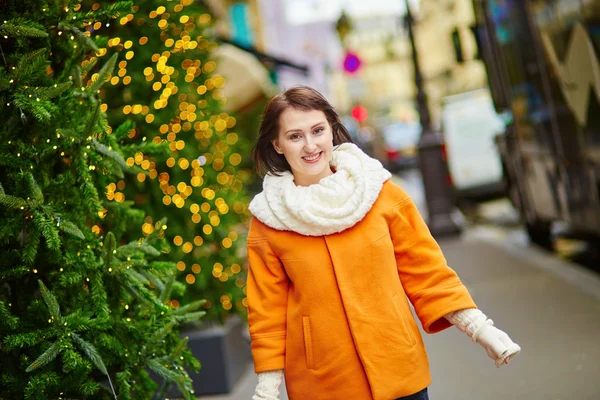Girl with a brightly decorated Christmas tre — Stock Photo, Image