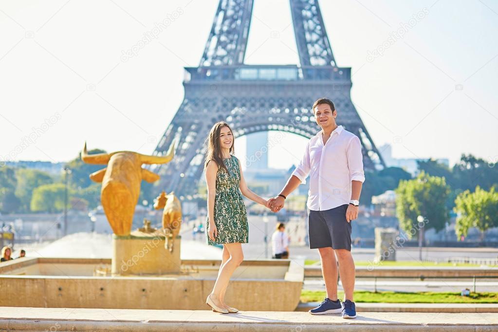 Young romantic couple in Paris near the Eiffel tower