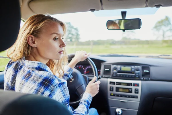 Young woman driving a car — Stock Photo, Image