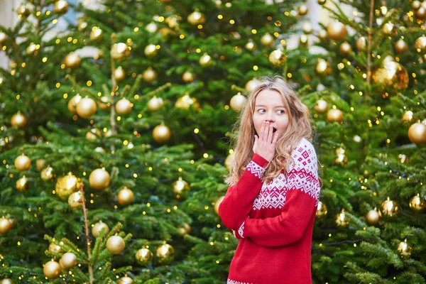 Girl with a brightly decorated Christmas tree — Stock Photo, Image