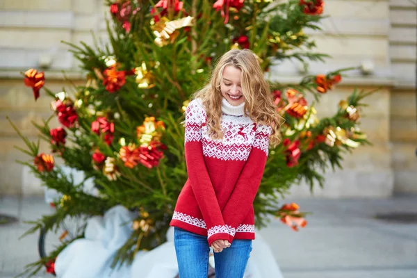 Girl with a brightly decorated Christmas tree — Stock Photo, Image