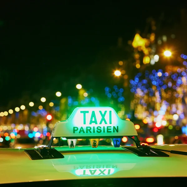 Green taxi sign in Paris, France — Stock Photo, Image