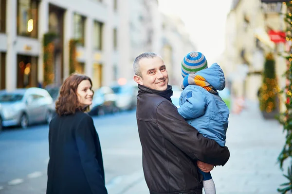 Happy family of three walking together in Paris — Stock Photo, Image