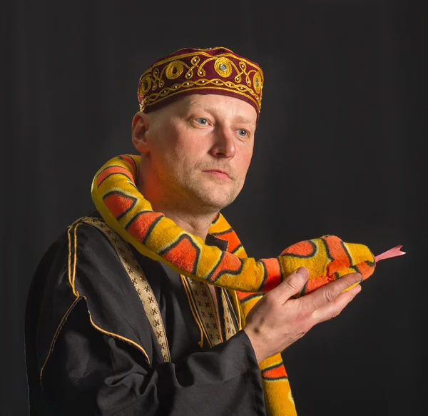 Actor with toy snake.