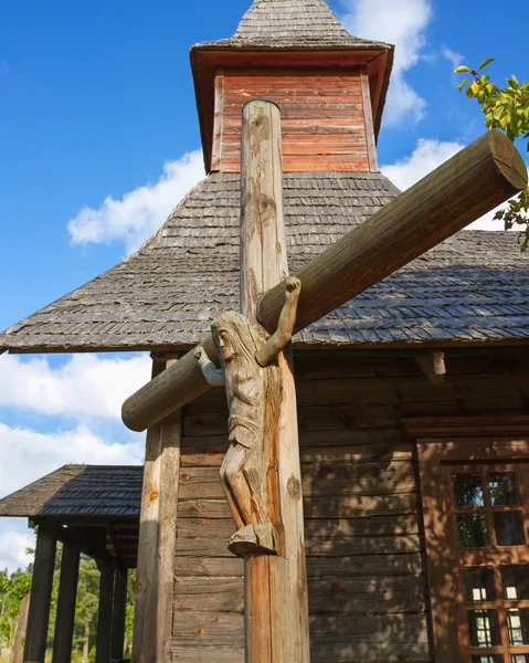 Cross and wooden church. — Stock Photo, Image