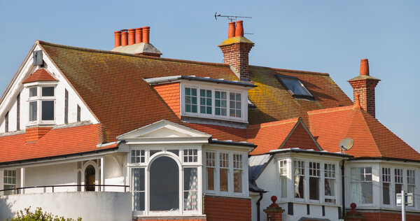 Homes in the Eastbourne with chimneys next to the English channel.