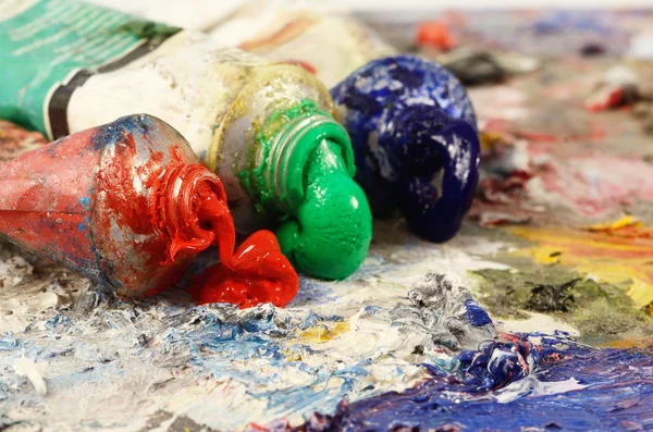 Art still life  - closeup of three oil paint tubes with red,green and blue colours ,background for creative art design — Stock Photo, Image