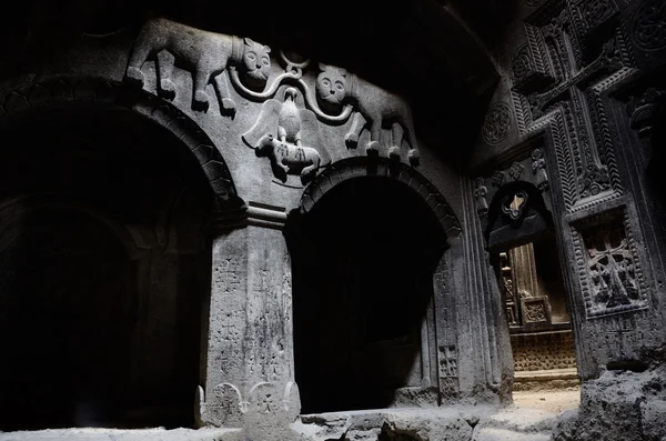 The hall of ancient christian temple Geghard with a dome, columns, and bas-relief depicting lions ,Armenia, unesco world heritage site — Stock Photo, Image