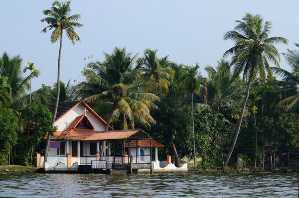 Rural church at Alappuzha backwaters,South India.Kerala backwaters is a chain of lagoons and lakes lying parallel to Malabar Coast, famous tourist attraction and unesco heritage site