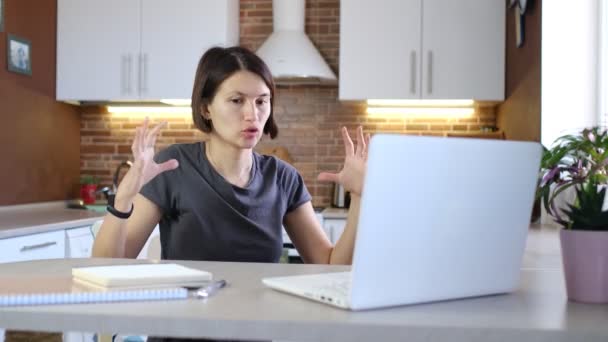 Female blogger is recording video with webcam of laptop — Stock Video