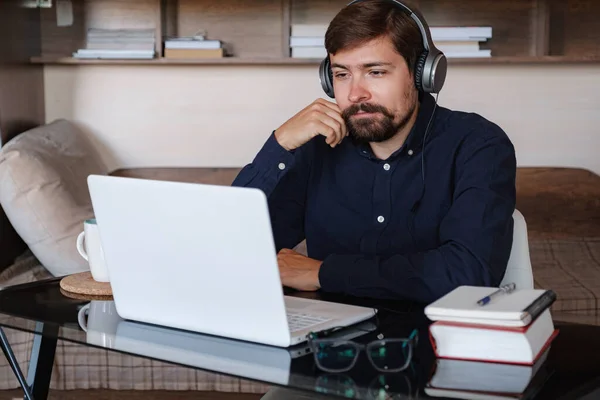 stock image Happy male student online teacher wear headphone talk video calling