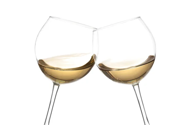 Vitt vin collection - skål! Klirr glas med vitt vin. Isolerad på vita backgroundwine snurra i en bägare vin glas, isolerad på en vit bakgrund — Stockfoto