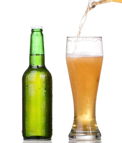 Pouring beer from bottle isolated on white background — Stock Photo, Image