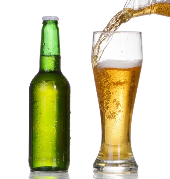 Pouring beer from bottle isolated on white background — Stock Photo, Image