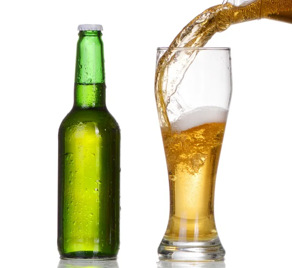 Pouring beer from bottle isolated on white background — Stock Photo, Image