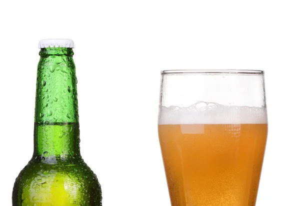 Chilled green bottle with condensate and a glass of beer lager on Isolated white background — Stock Photo, Image
