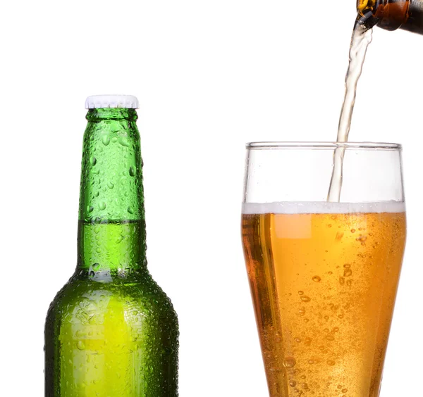 Pouring beer from bottle isolated on white background — Stock Photo, Image