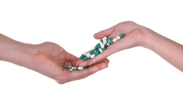 Pillole in mano isolato su sfondo bianco — Foto Stock