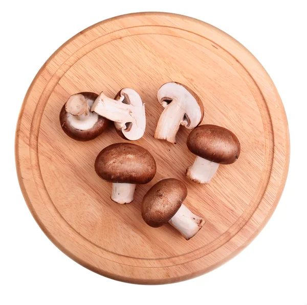 Biały brązowy grzyb na pokładzie drewnianym tle — Zdjęcie stockowe
