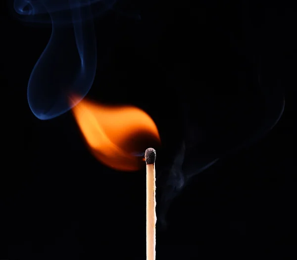 Ignition of a match, with smoke on dark background — Stock Photo, Image