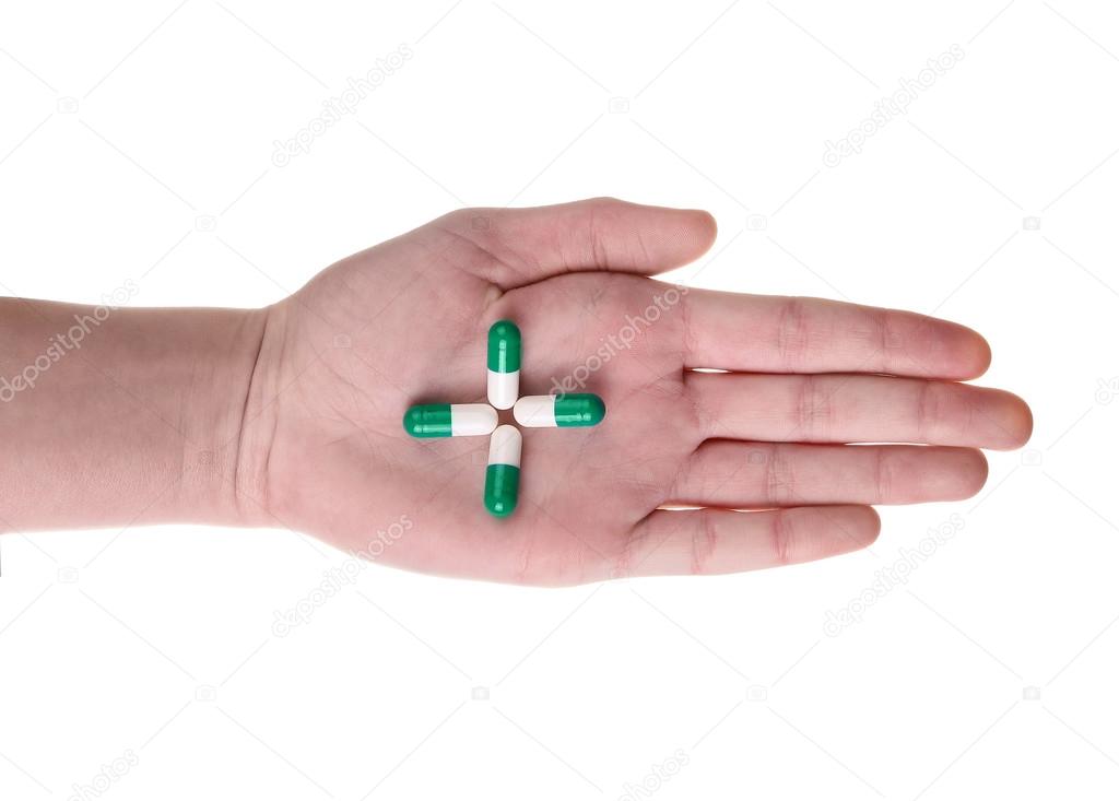 Pills in hand isolated on white background