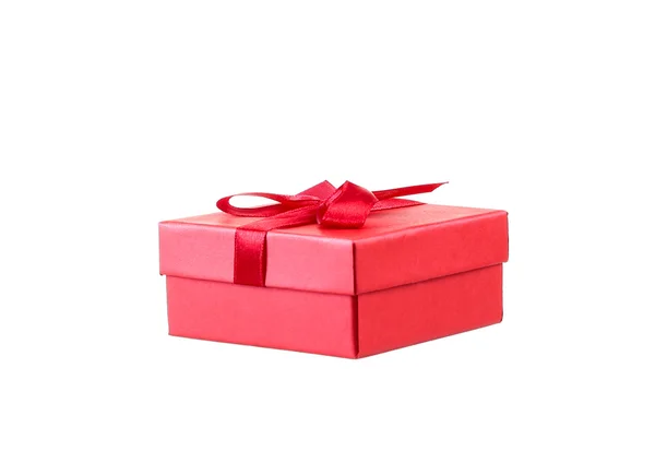 Red gift box with white ribbon isolated on red background. Clipping path included. — Stock Photo, Image