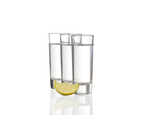 Three  tequila shots with lime isolated on white background — Stock Photo, Image