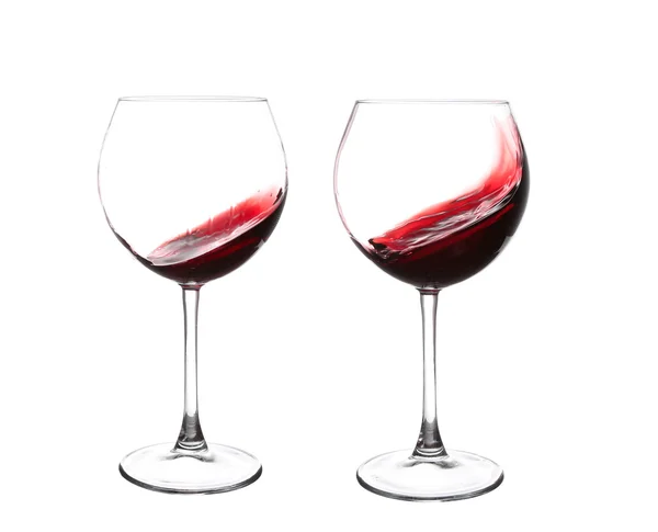 Red wine swirling in a goblet wine glass, isolated on a white ba — Stock Photo, Image