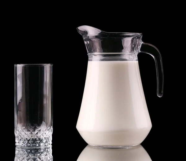 Splash in a glass with milk isolated on black — Stock Photo, Image